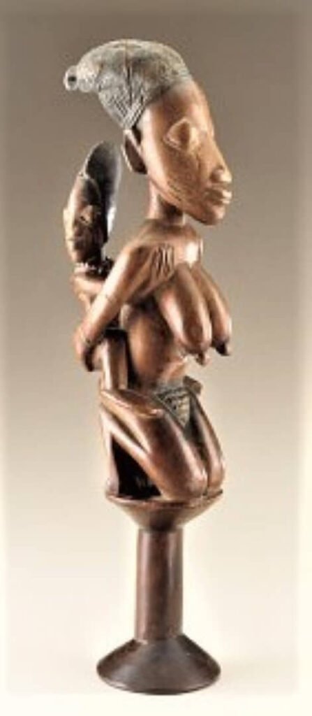 145 Bastón ceremonial. Finales del siglo XIX principios del siglo XX . Madera, añil, cuentas de vidrio. Medidas: 41.4 x 9 x 11.9 cm. Fondos del Programa Smithsoniam de Adquisición de Colecciones.            Nº re: 88-1-1